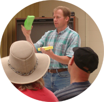 Troy Peters gives a water holding demonstration for growers